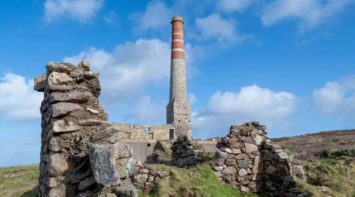 Red and white striped chimney with stone base at Geevor Tin Mine