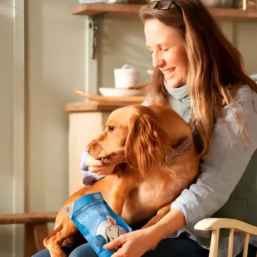 Blue and white rabbit-themed pet food bag with a silver zipper.