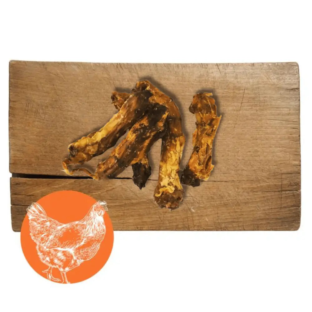 Chicken necks chew on wooden board with chicken silhouette for dogs