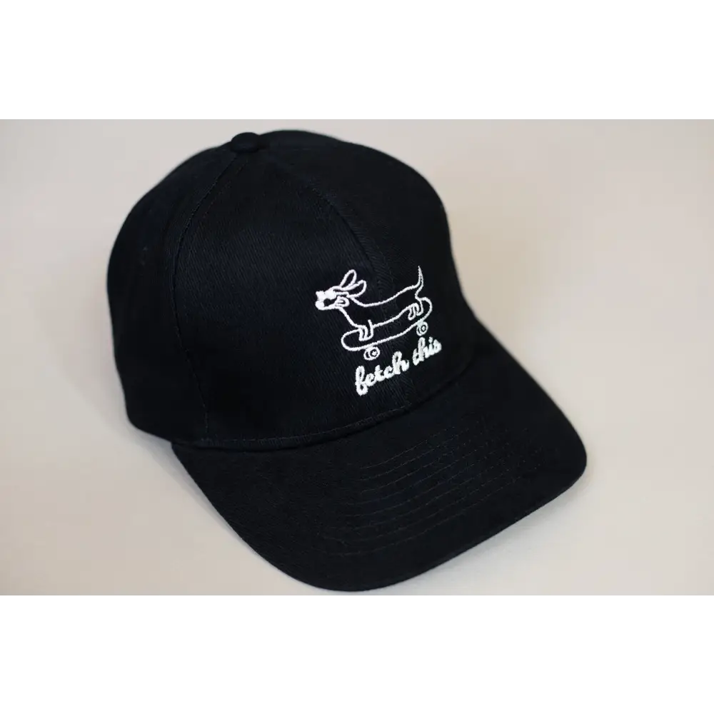 Black cotton cap with embroidered dog on skateboard and skate or die text for stylish wear