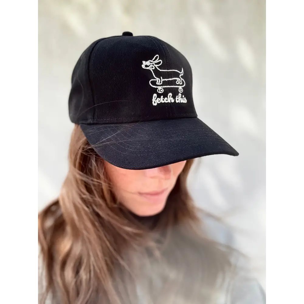 Black cotton cap with white embroidered fetch this design, ideal for casual wear