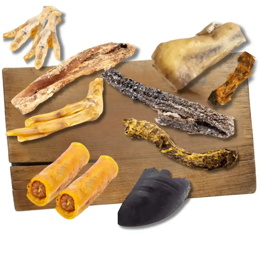 Various dried animal treats arranged on a wooden board