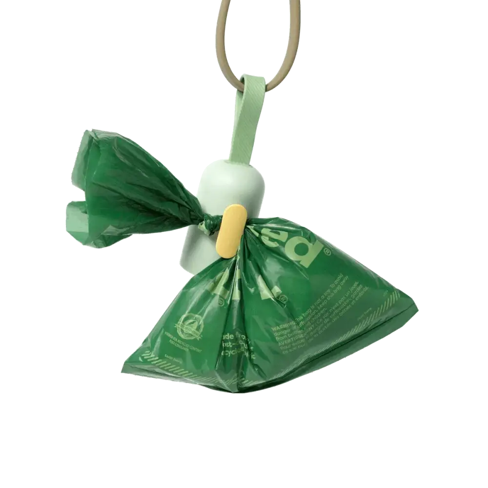 Earth Rated Poop Bags Lavender dispenser with green recycled plastic, white handle, yellow button, leak-proof guaranteed, 120 bags on 8 refill rolls