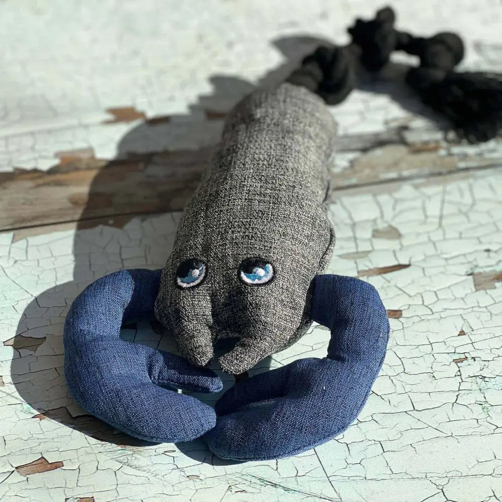 Eco-conscious lobster dog toy from recycled fabrics and plastic bottles