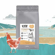 Evie Dry Cat Food Turkey & Chicken on a seaside background