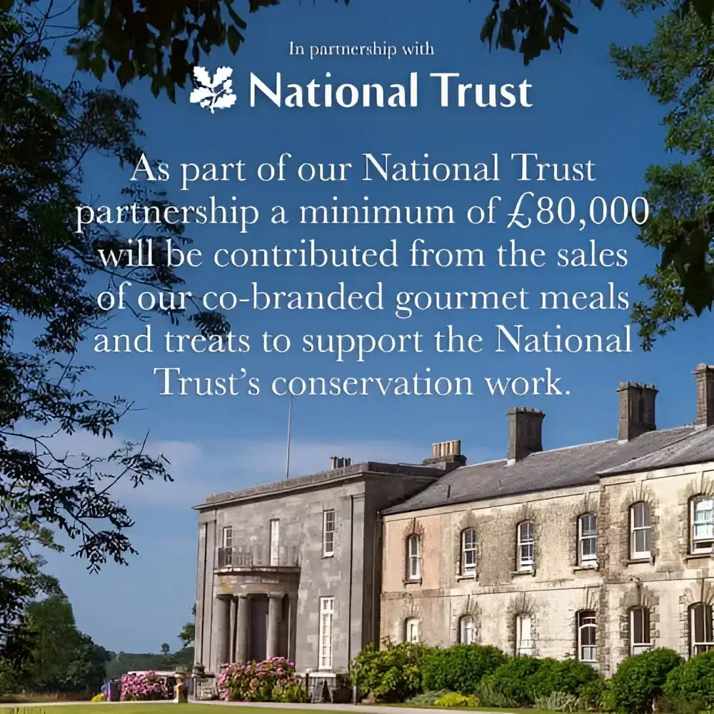 Stone mansion with classical columns and pink flowers for Forthglade National Trust soft bite treats