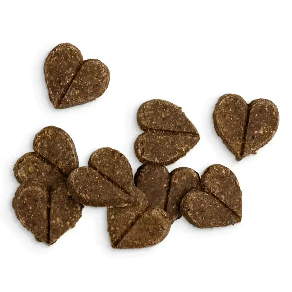 Heart-shaped dog treats with textured surface, brown color, white speckles, ideal as natural cat food