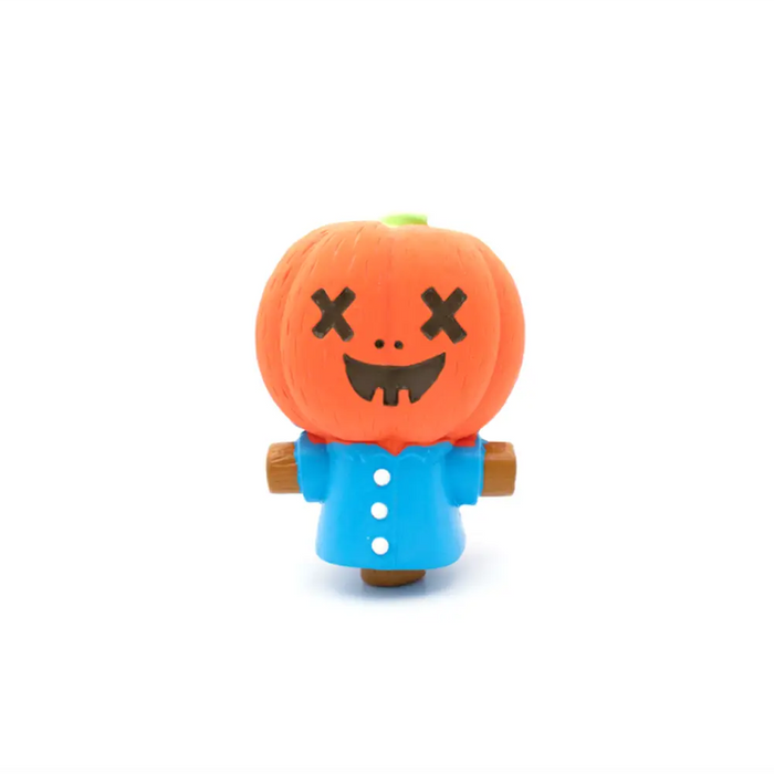 Toy figure with pumpkin head and blue shirt on a white background