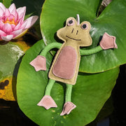 Green and Wilds Francois Le Frog eco fun toy made with green limbs and pink belly on lily pad