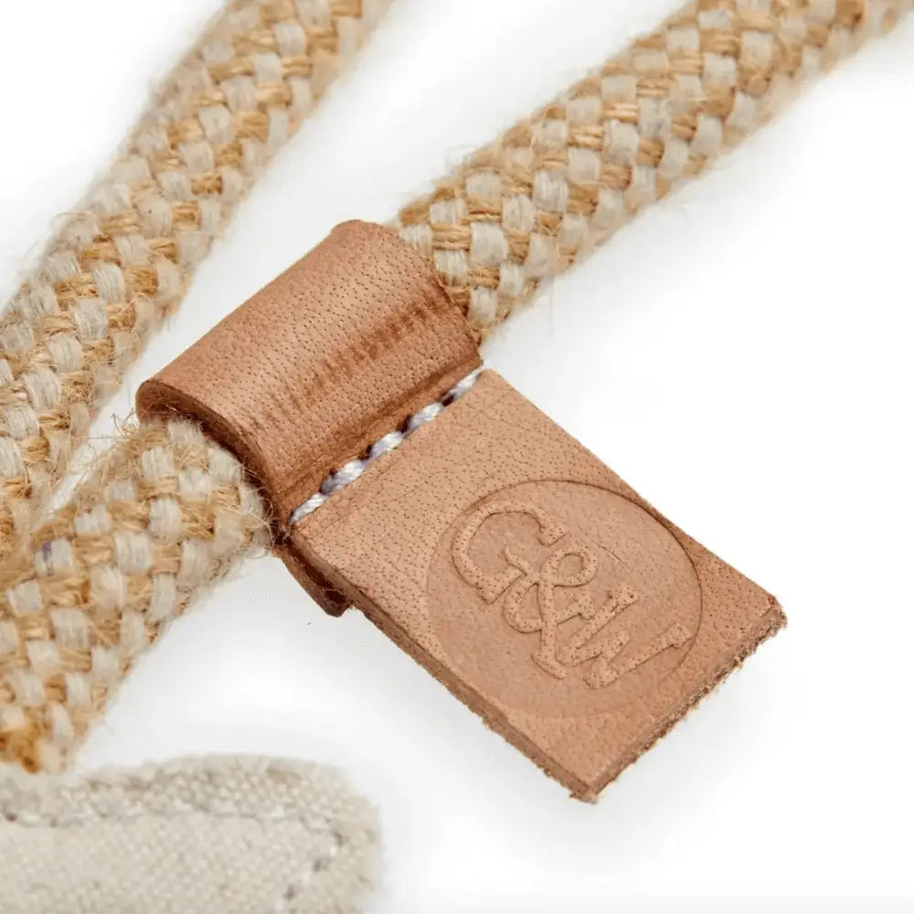 Beige woven belt with leather buckle on Lizzie Bonefish Eco toy
