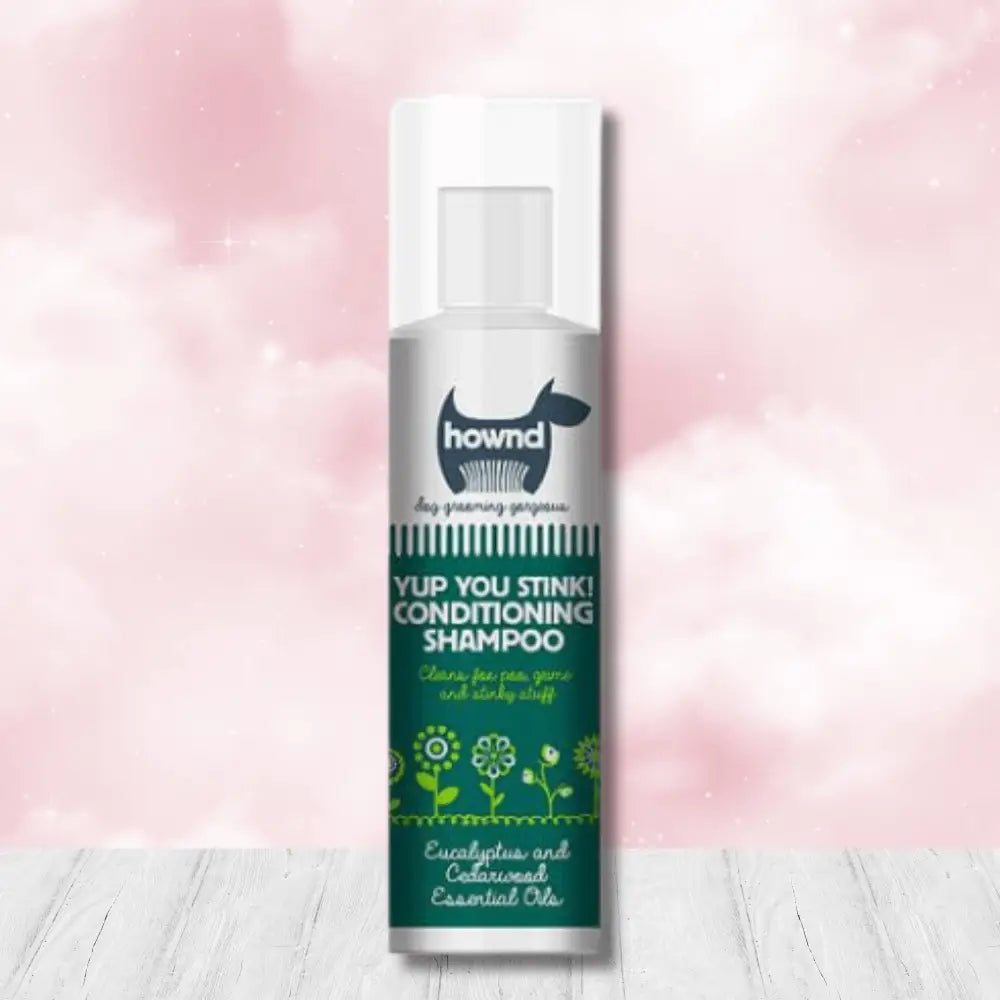 Hownd Yup You Stink Conditioning Shampoo bottle with floral design and white cap, infused with cedarwood essential oils and fox poo scent
