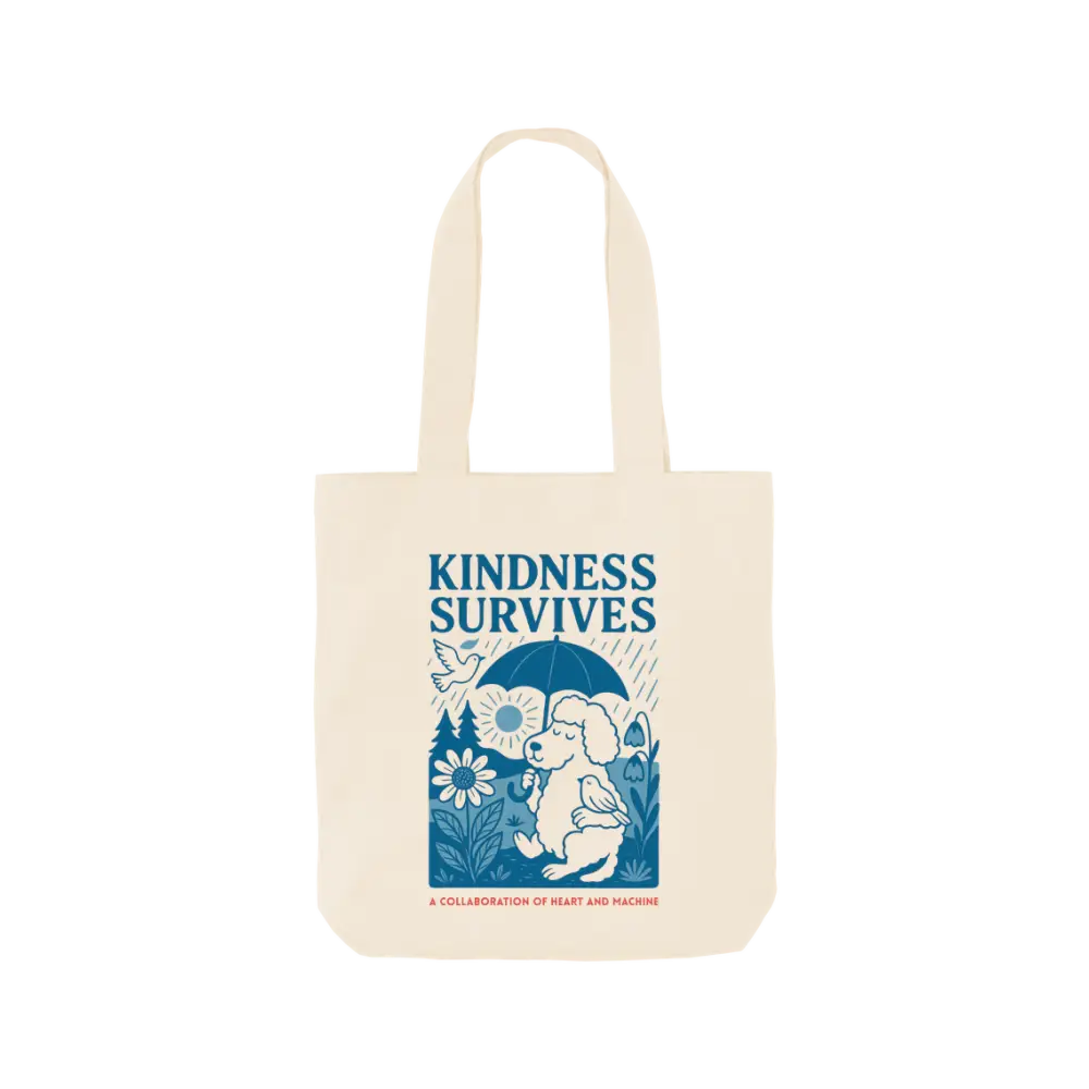 Cream-colored tote bag with blue elephant design and kindness survives message for natural cat treats