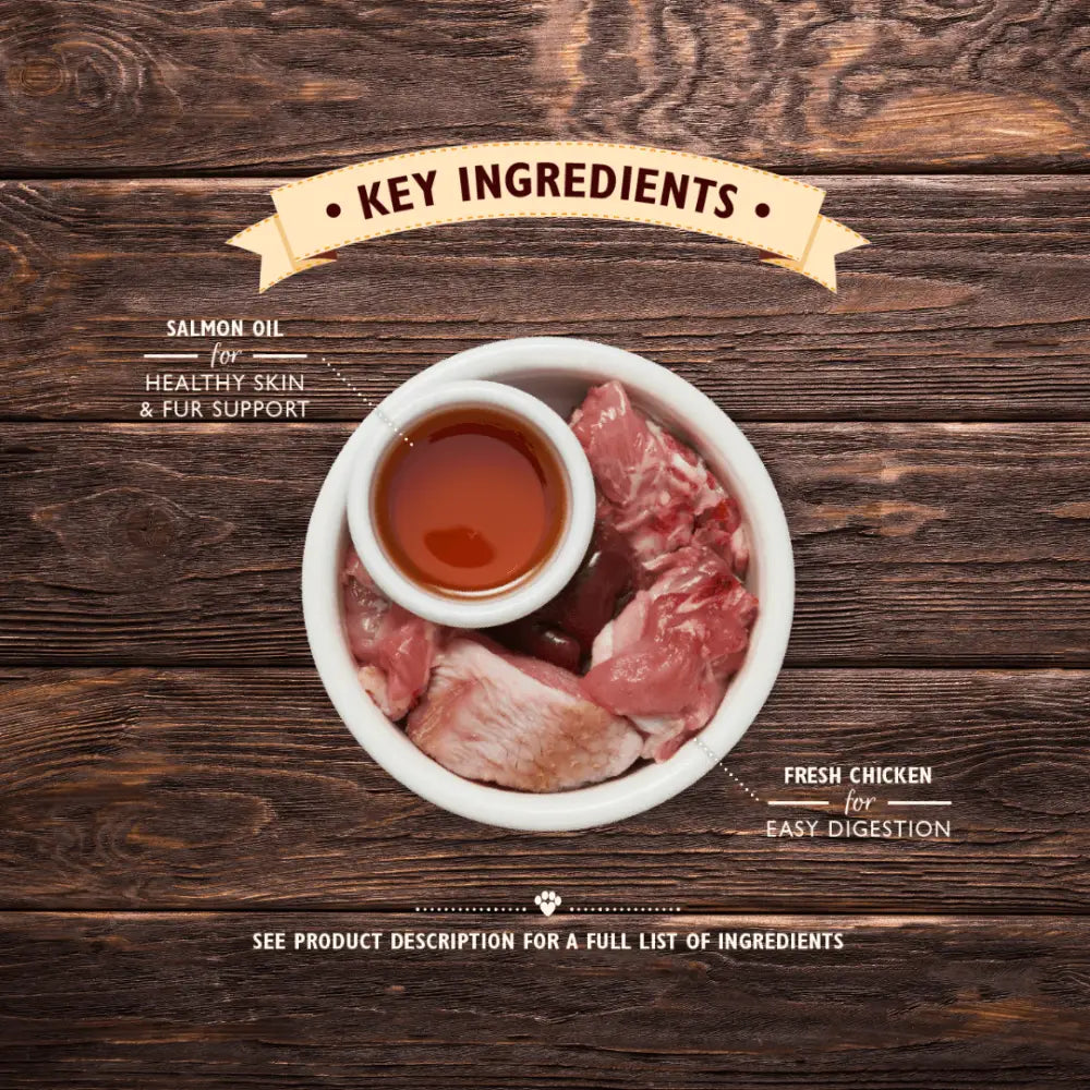 Grain-free Lily’s Kitchen Chicken Pate: salmon oil bowl with proper meat chicken and sauce on wood