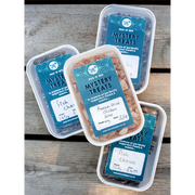 Mystery Treat Box with blue and white label and clear plastic lid