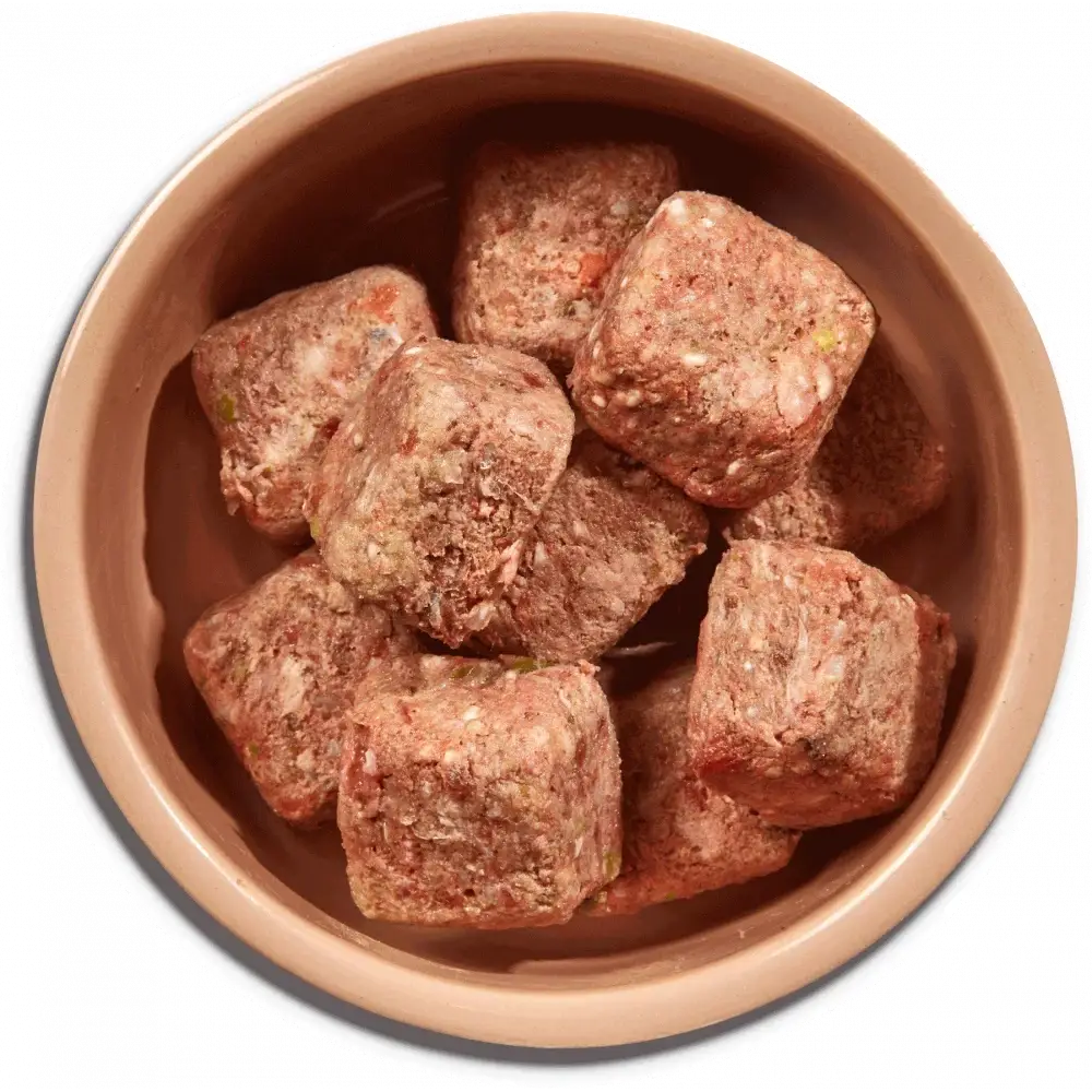Brown ceramic bowl of Natures Menu beef chicken dog food nuggets with brown rice