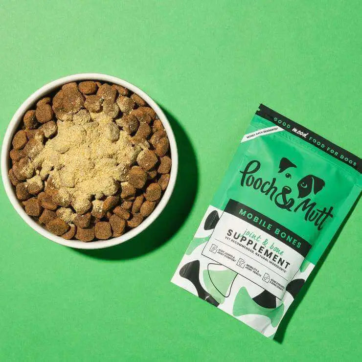 Pooch & Mutt Mobile Bones 200g: dog bowl with kibble, powder, and green bag