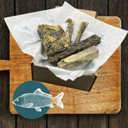 Wooden cutting board with large wolf fish stick design in The Fish Chew Box