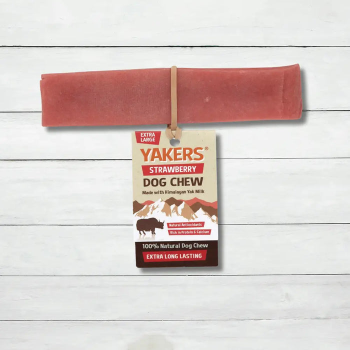 Yakers Strawberry Yak Chew sits on a rustic background. This product can be bought at The Pets Larder natural pet store