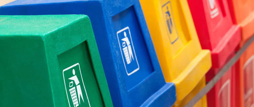 Multi-colored bins for recycling pet food pouches, plastic, glass, paper