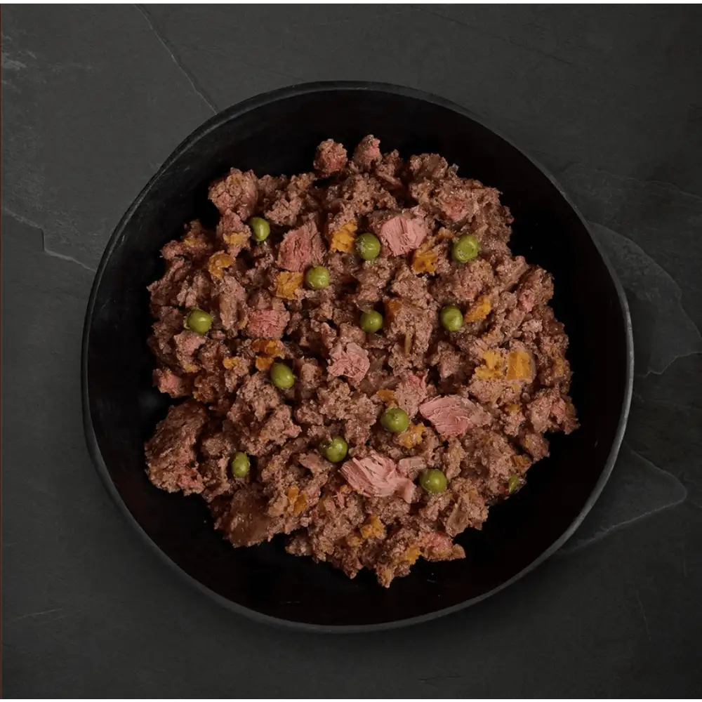 Black plate with ground beef and peas from Canagan Wet Dog Food balanced grain-free food