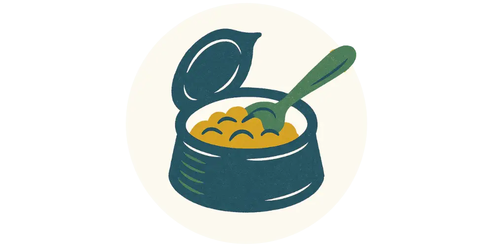 Teal and yellow bowl with spoon and open lid of natural wet dog food inside