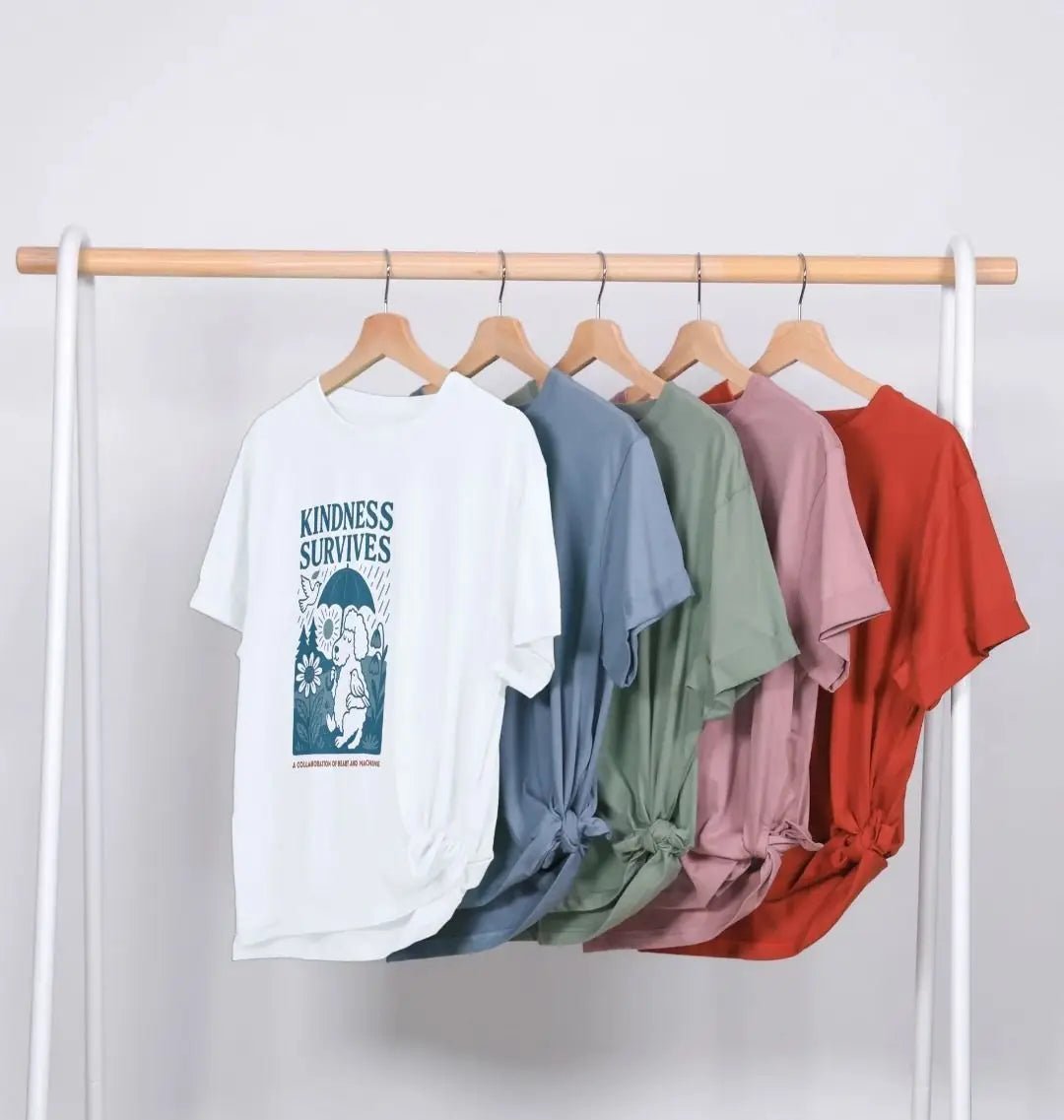 White t-shirt with Kindness Survives print from Paws for Peace Collection