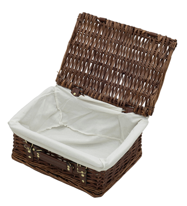 Wicker picnic basket with white interior on a white background