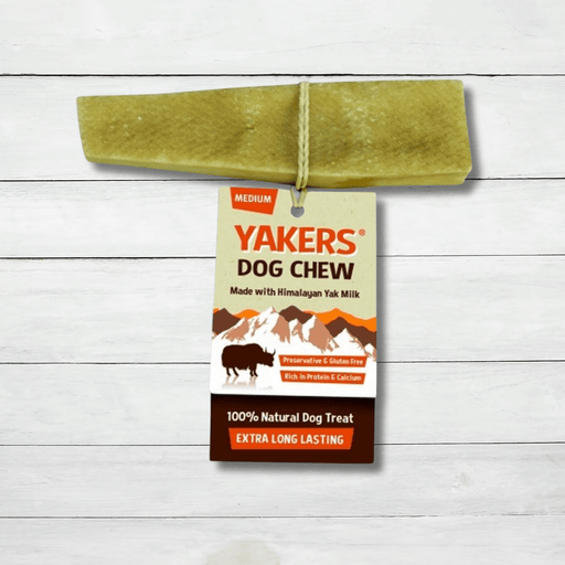 A Medium Yak Chew For Dogs sits on a white rustic background. These chews can be bought at The Pets Larder natural pet store