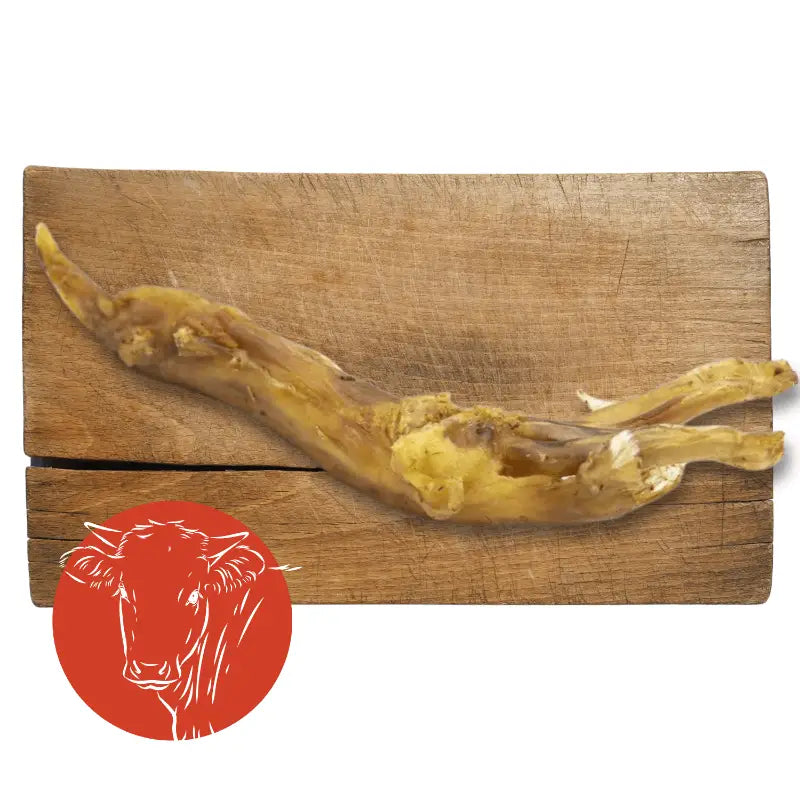 Beef Achilles Tendon natural dog chew on wooden board with red cow logo