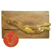 Beef Achilles Tendon natural dog chew on wooden board with red cow logo