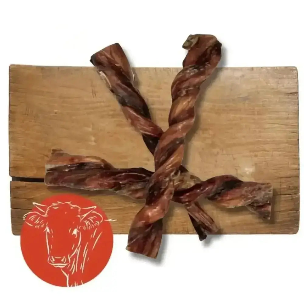 British Twisted Pizzle: Twisted Bull Pizzle Jerky Sticks on Wooden Board