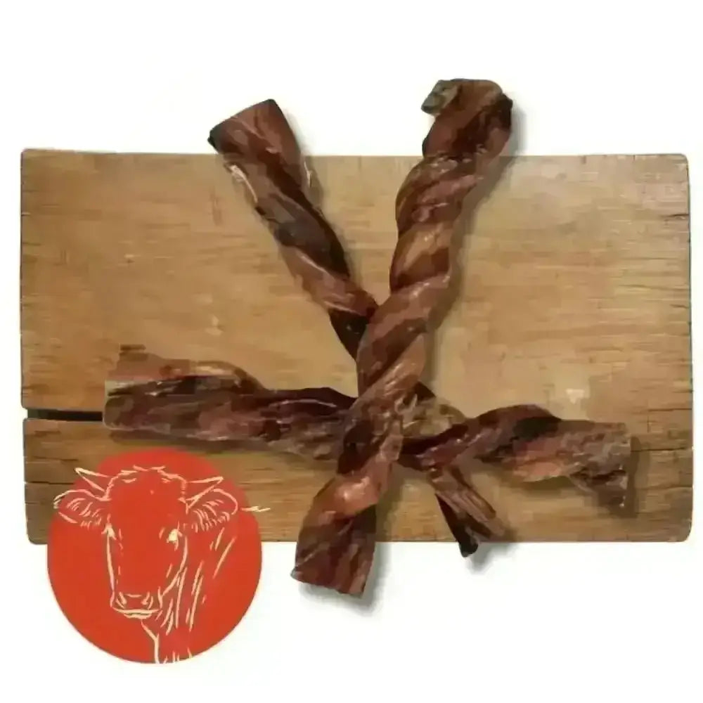 British Twisted Pizzle: Twisted Bull Pizzle Jerky Sticks on Wooden Board