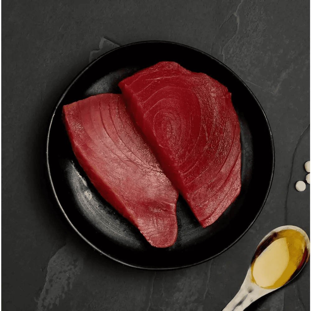 Raw ocean tuna steak plate with spoon and oil for Canagan Cat Food Can - Highly nutritious complete cat food