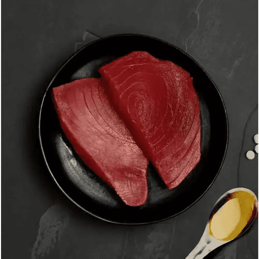Raw ocean tuna steak plate with spoon and oil for Canagan Cat Food Can - Highly nutritious complete cat food