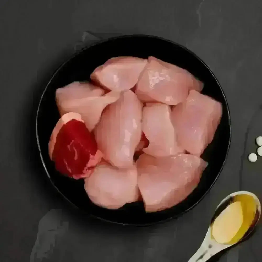 Raw chicken breast slices with red pepper and oil for Canagan Cat Food Can - Chicken with Beef
