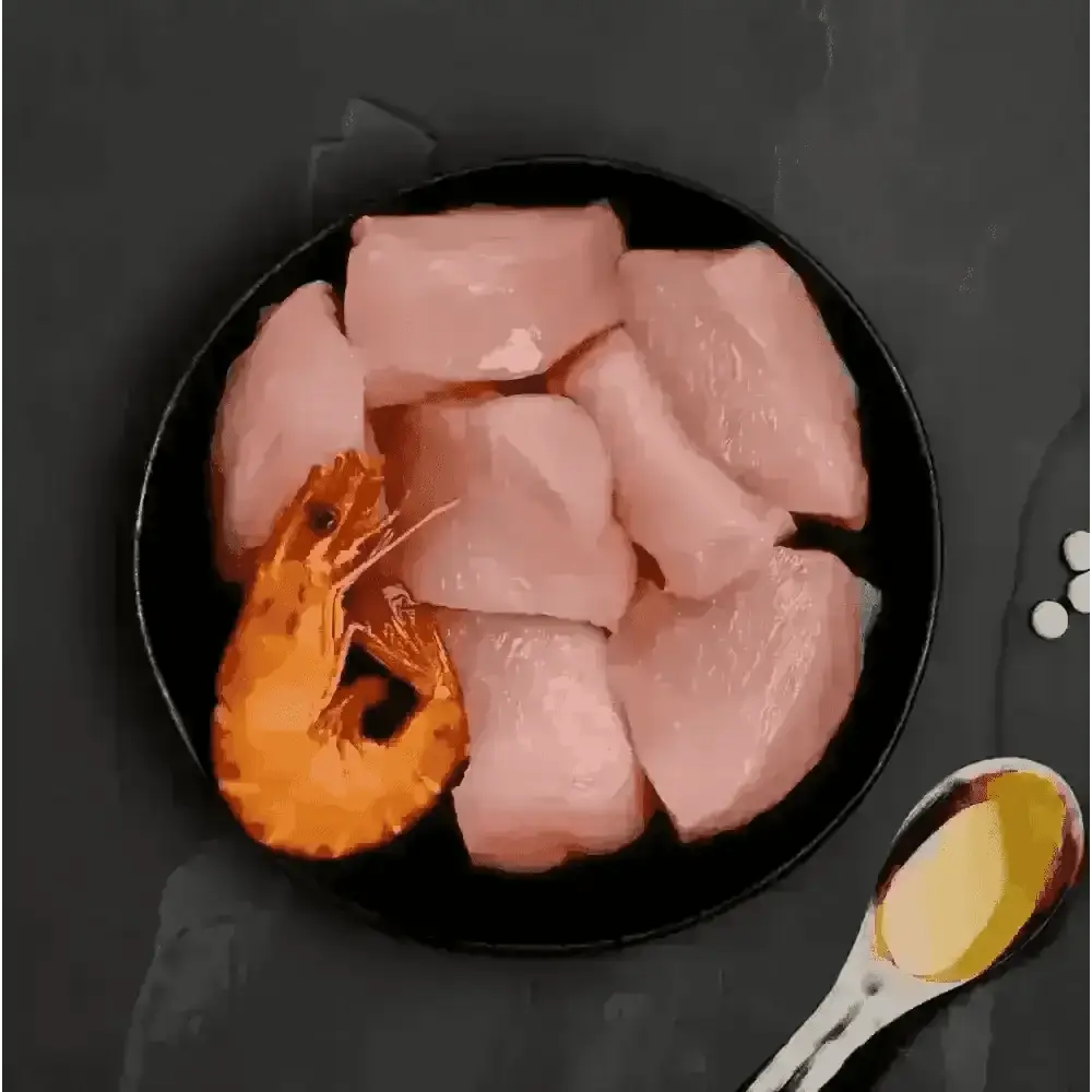 Canagan highly nutritious complete cat food with raw chicken breast slices and whole shrimp