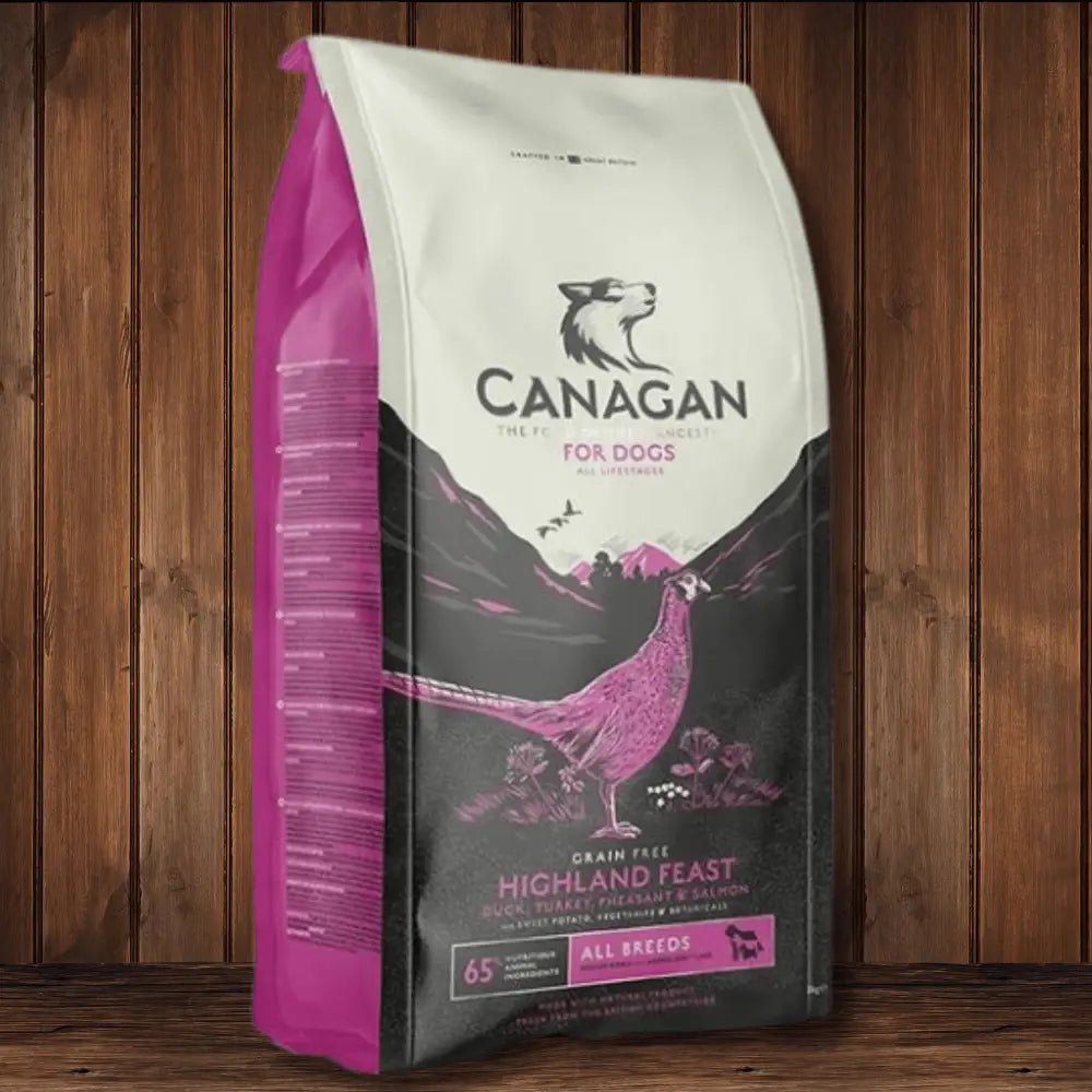 Canagan Highland Feast dog food bag with pink white packaging and bird illustration