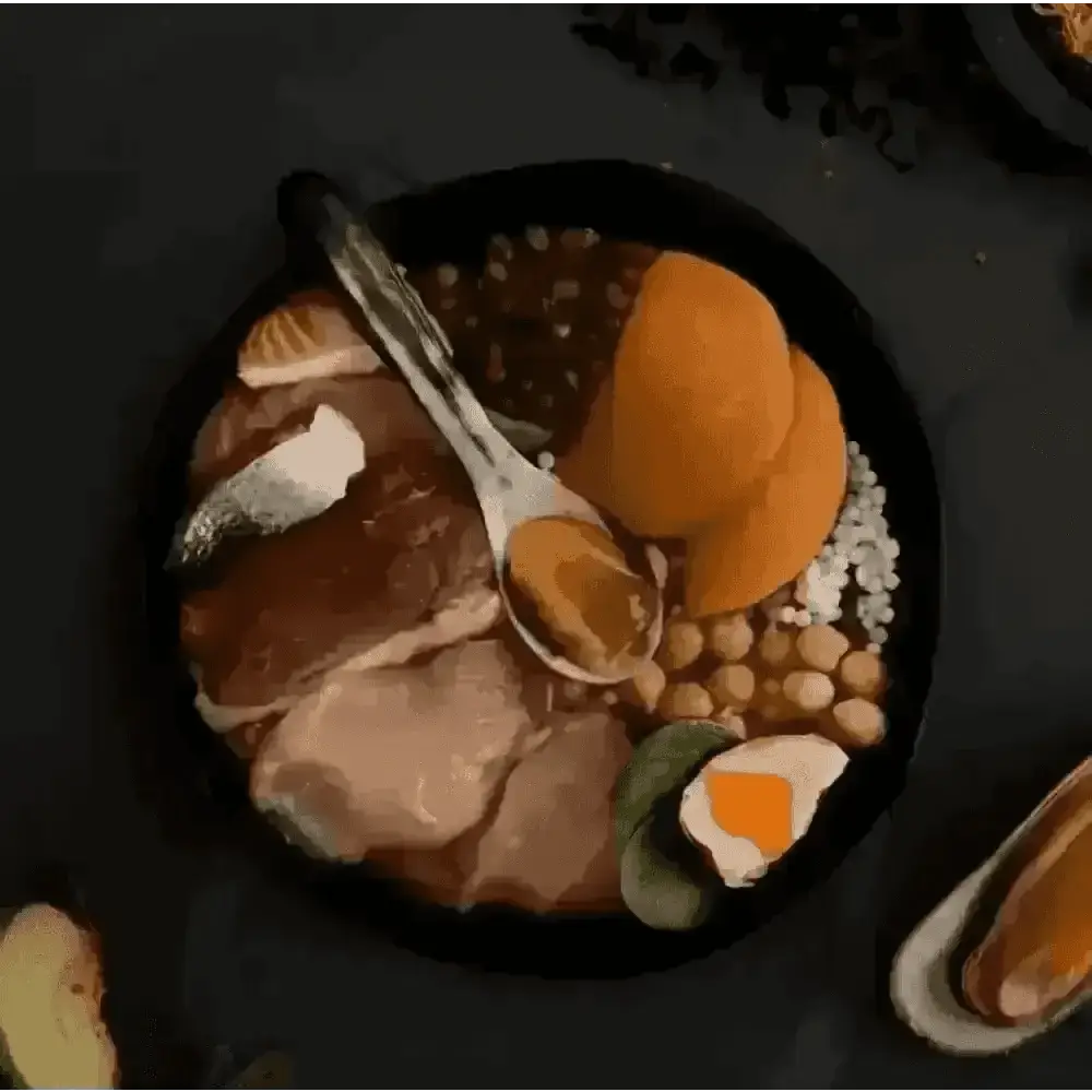 Canagan Highland Feast black bowl with assorted foods and utensils