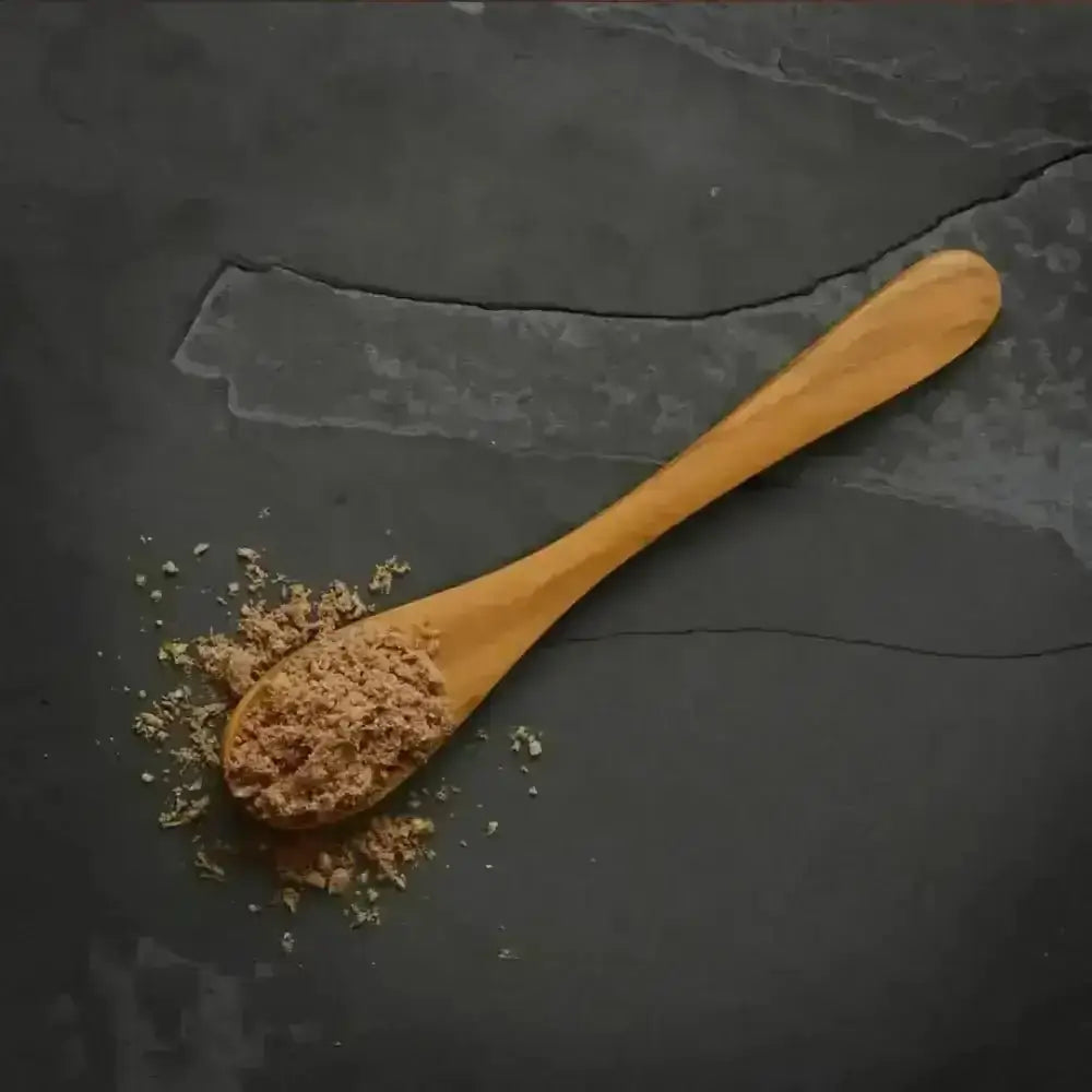 Canagan Raw Freeze-dried chicken topper on wooden spoon