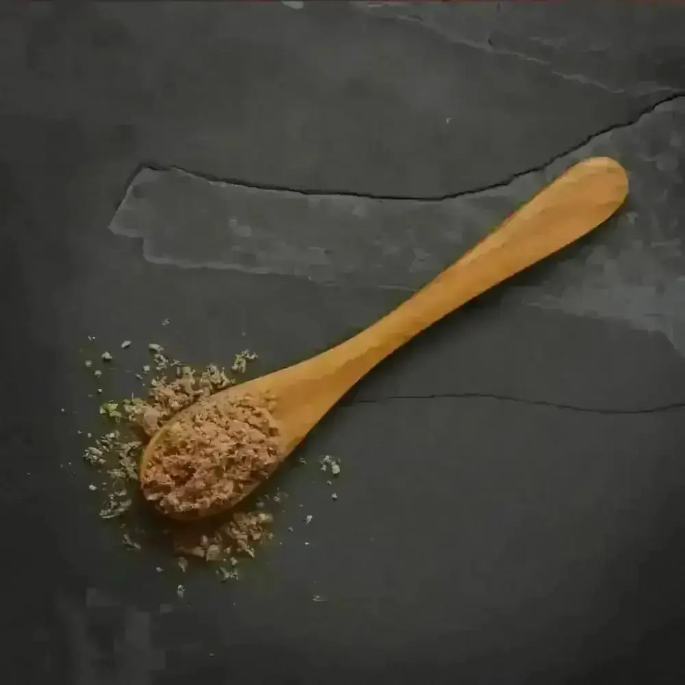 Canagan Raw Freeze-dried chicken topper on wooden spoon