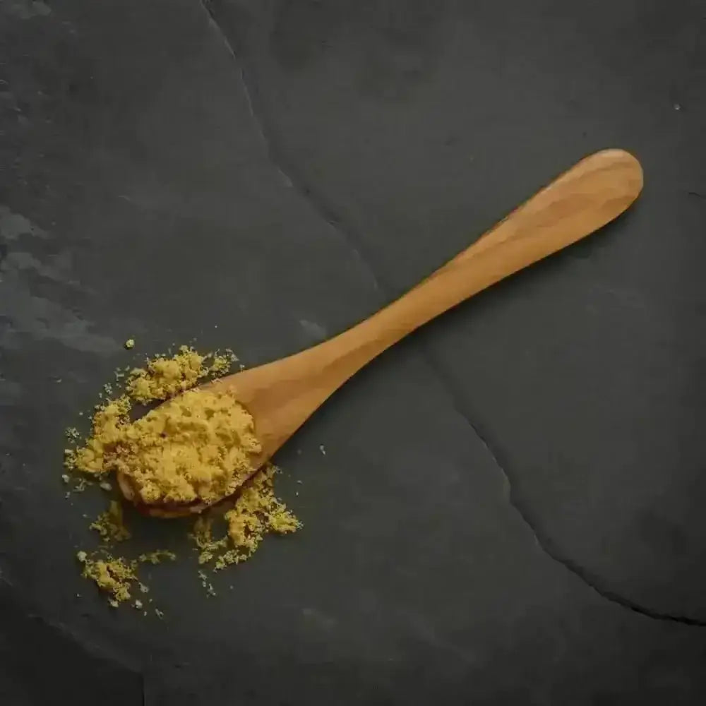 Canagan intensely flavoured freeze-dried fish topper on wooden spoon