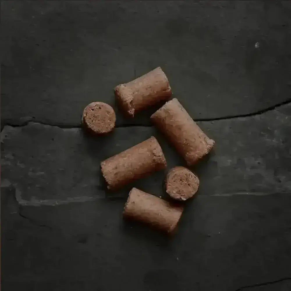 Canagan Raw Freeze Dried Beef Treats: Chocolate Wafer Rolls on Slate