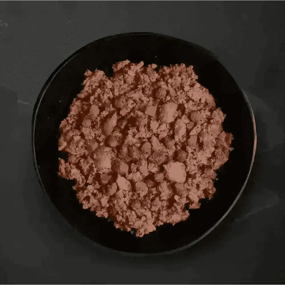 Black bowl with chicken hotpot wet dog food containing pinkish food, green peas, corn, and brown bits