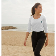 Woman in certified organic cotton Natural Cornish Pet T-shirt with black leggings and ponytail