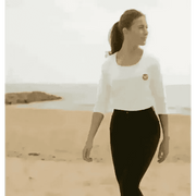 Woman in certified organic cotton Natural Cornish Pet T-shirt with black leggings and ponytail