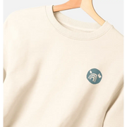 Certified organic women’s oversized NCP logo jumper in cream with teal design