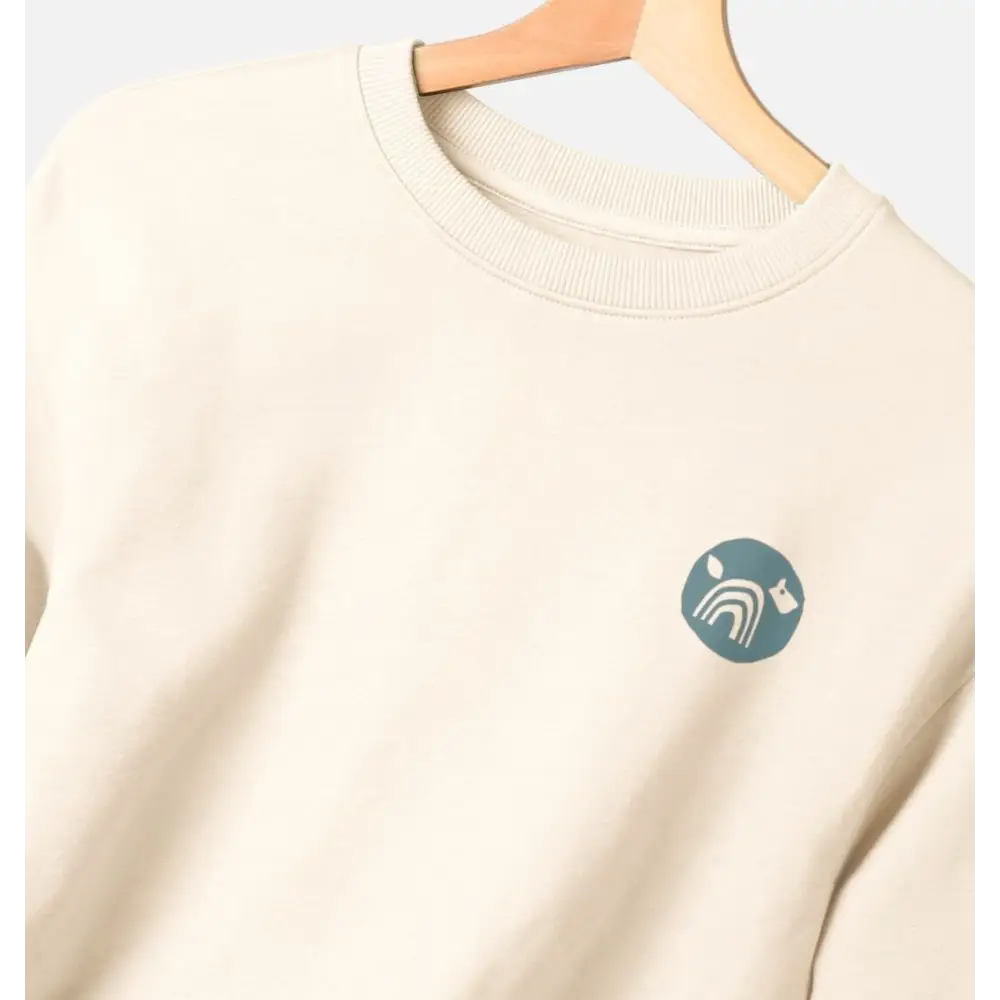 Certified organic women’s oversized NCP logo jumper in cream with teal design