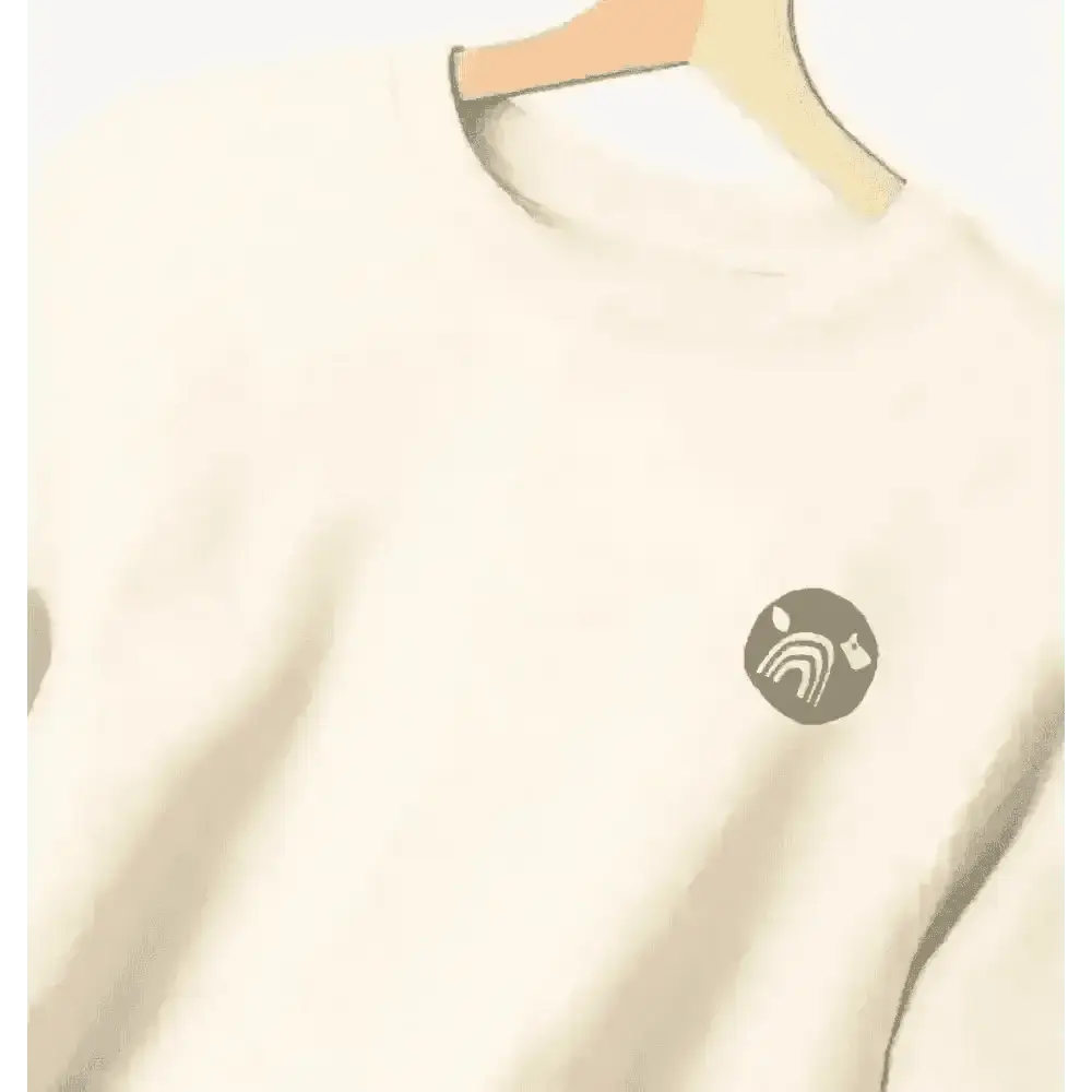 Certified organic women’s oversized NCP logo jumper in cream with teal design