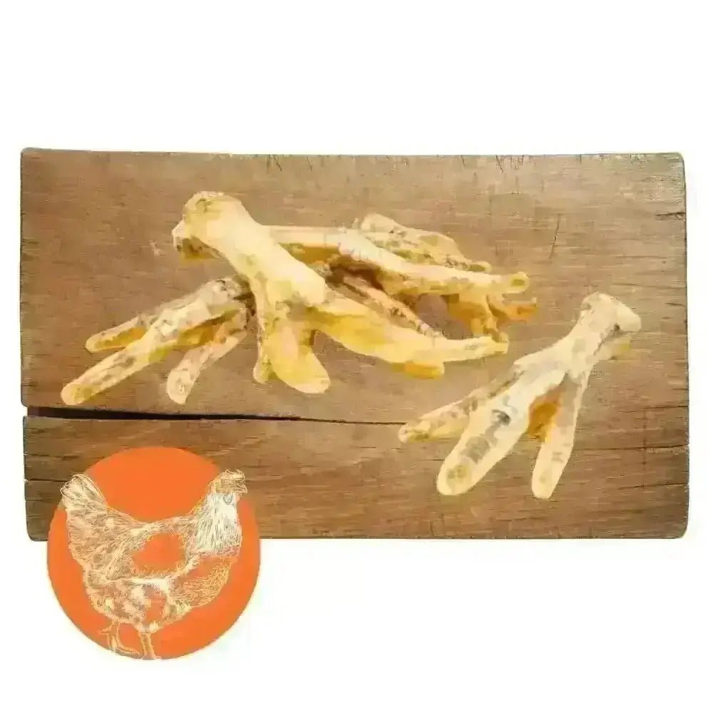 Bone-shaped chicken foot natural dog chew treats on wooden surface for dogs