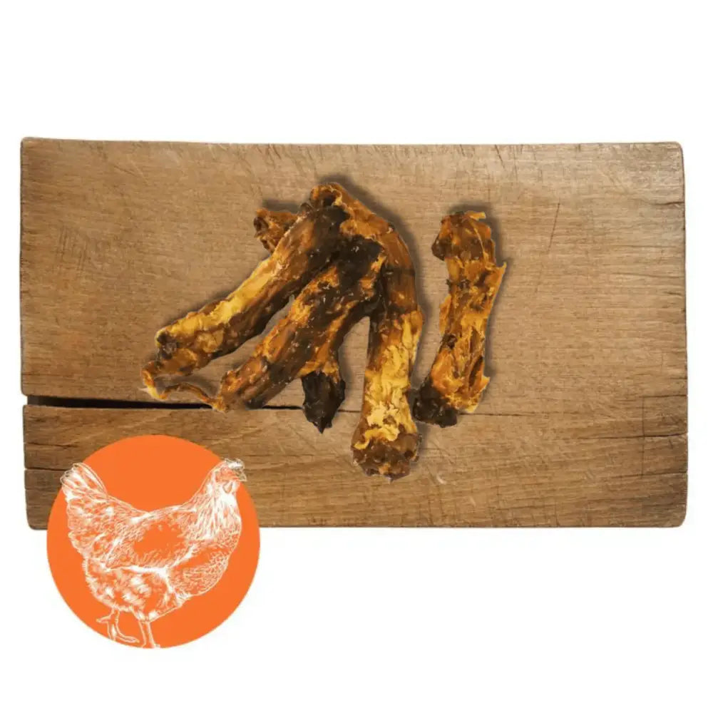 Pets Larder Chicken natural meat chew: wooden board with chicken necks, bones, and silhouette for dogs chewing experience